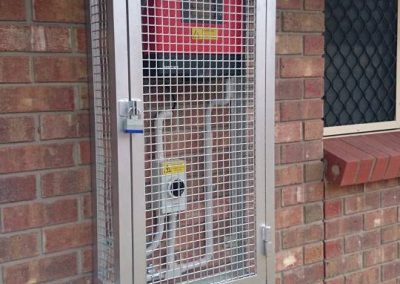 Cage installation for hot water system protection in South Australia