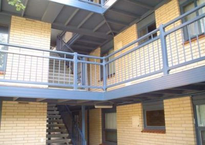 Multiple Handrails fabricated powder coated and installed in a block of flats in Adelaide